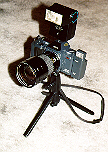 (Picture of the camera with lens and flashes attached)